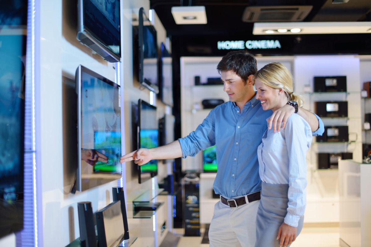 couple shopping for a new flatscreen tv