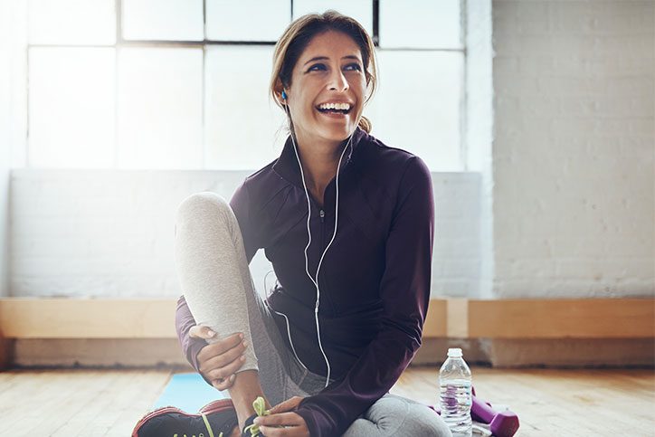 girl in workout gear stretching