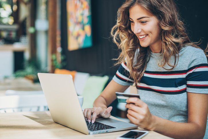 girl with credit card and laptop