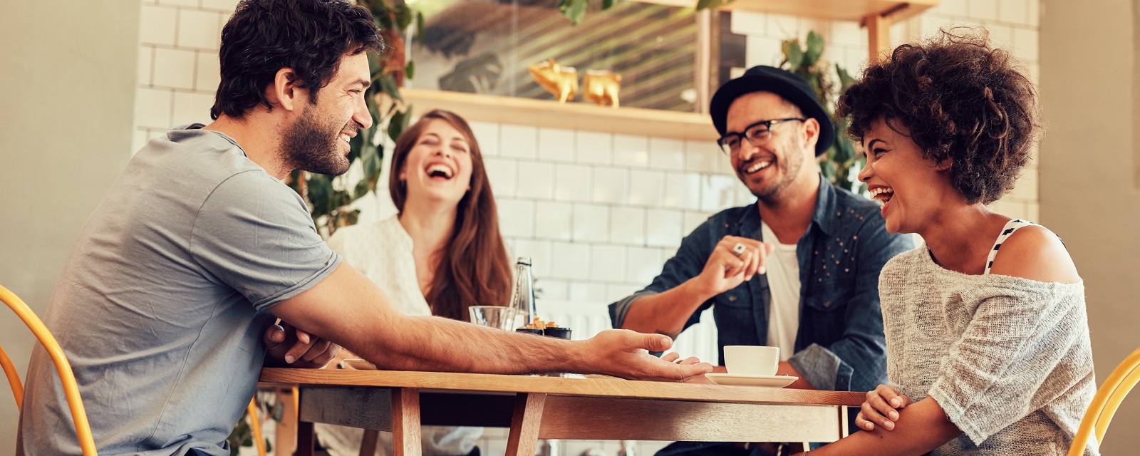 Friends smiling together at a table