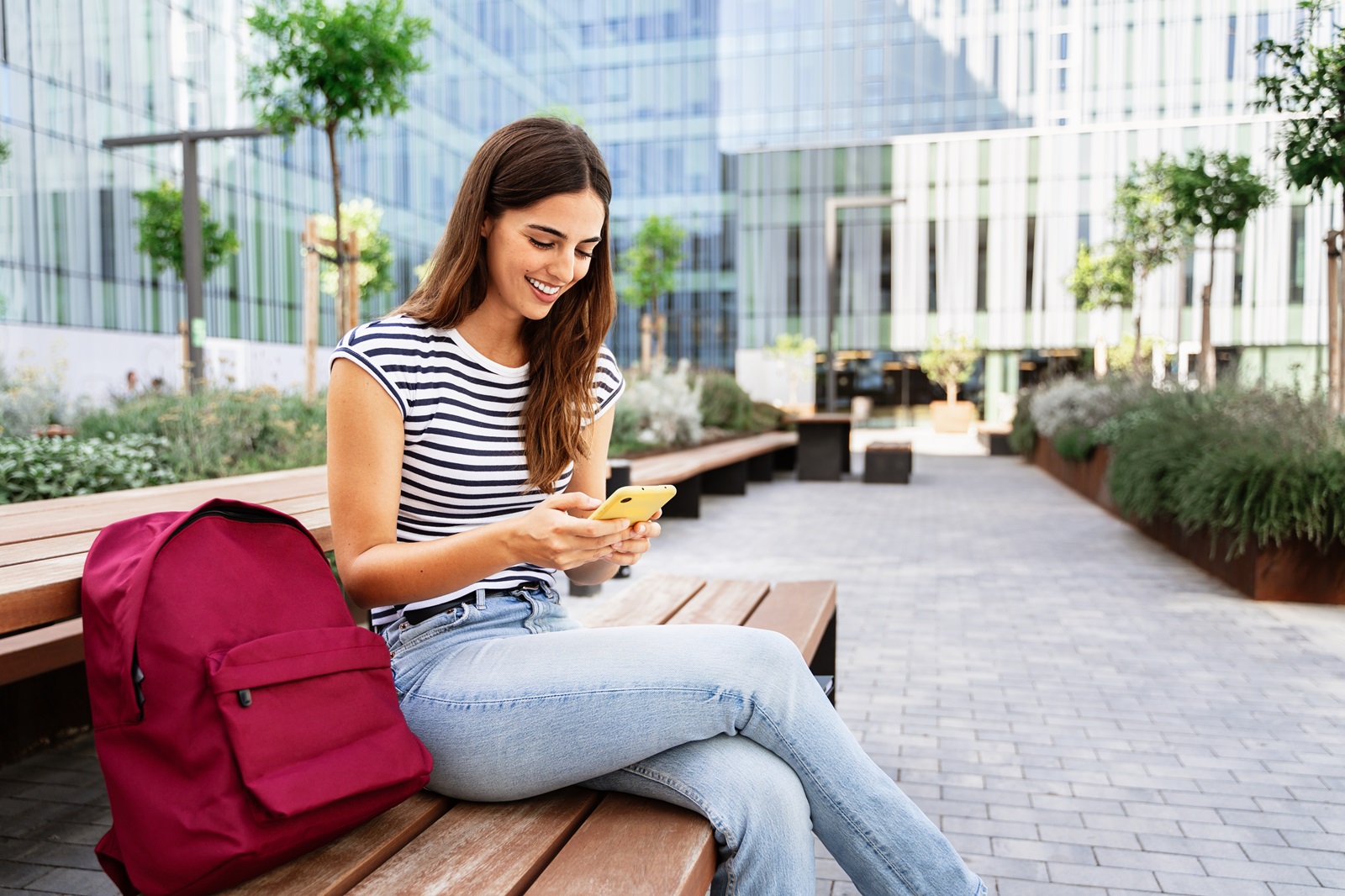 Woman smiling looking at phone