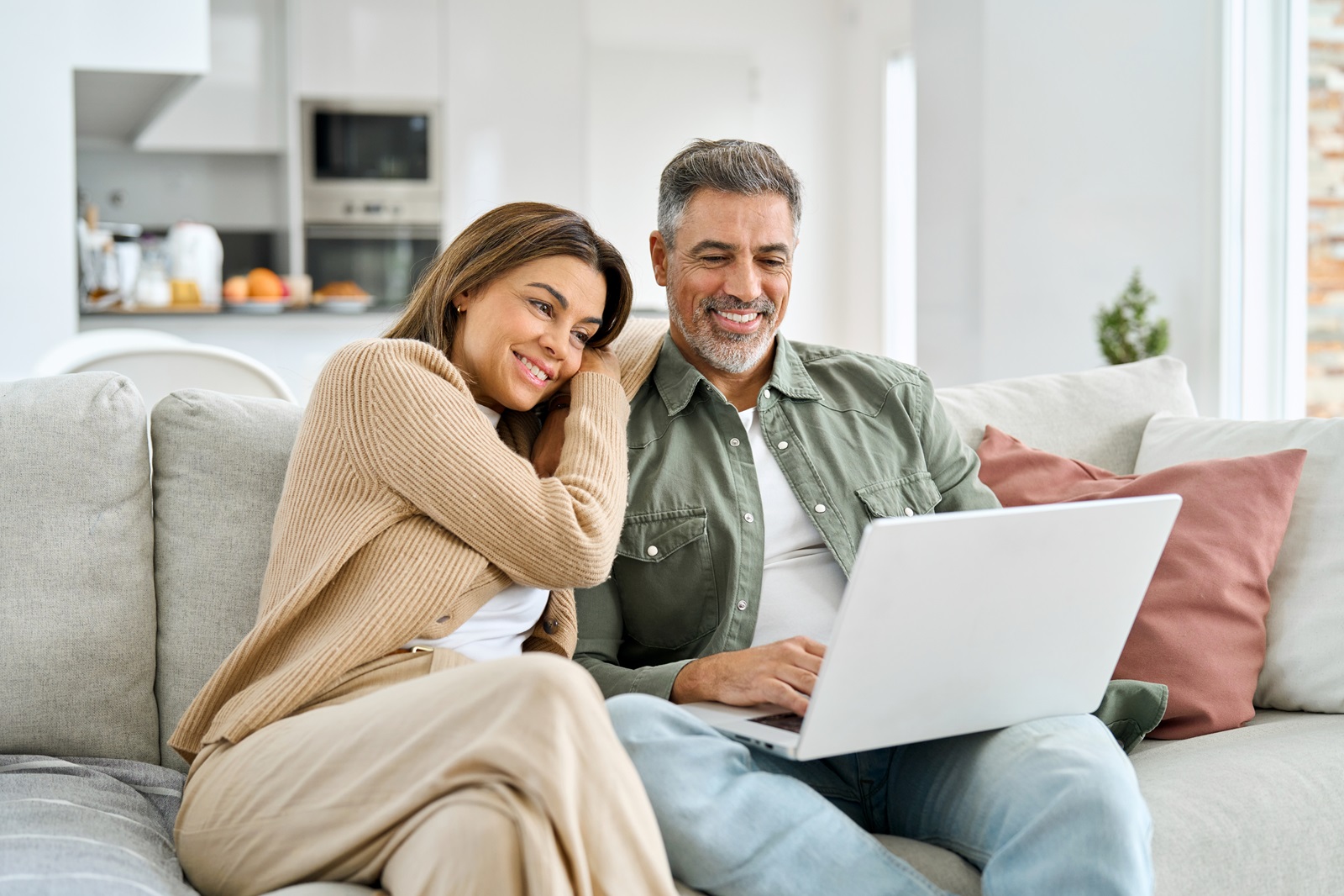 Couple on couch with laptop