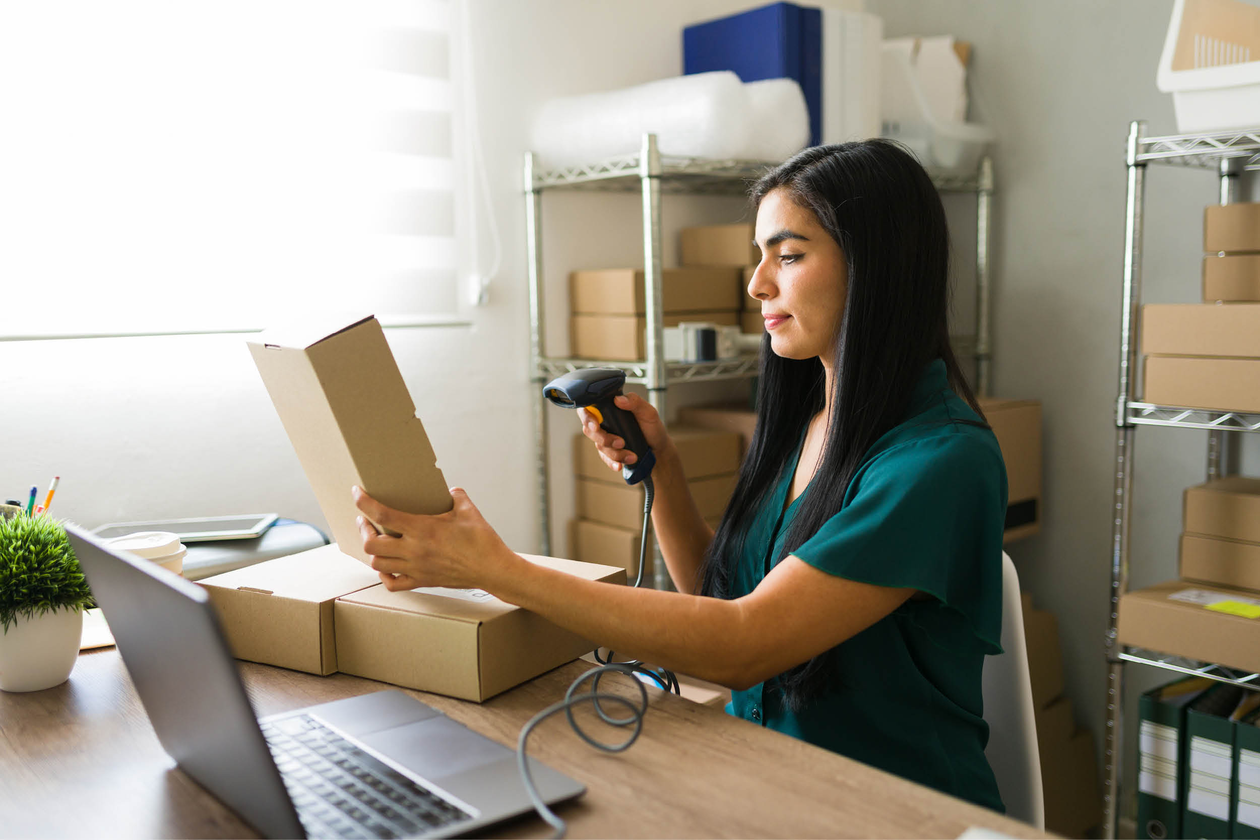 woman scanning box